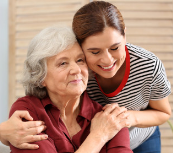 caregiver assisting elderly woman